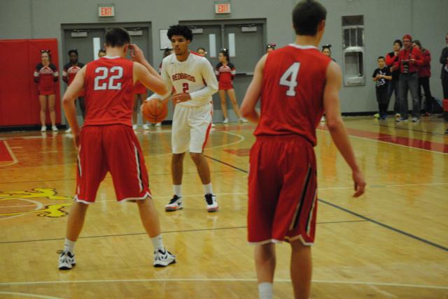 Marcus Latham directs the point of Alton's offensive attack against Chatham Glenwood. (Photo by Brent Feeney)