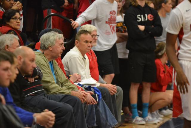 Richard Baird (far right) and some other fans are constant supporters of Alton’s basketball program. The Alton High athletic department expects strong support of the team this Friday when it travels to the IHSA Class 4A Pekin Sectional championship game.