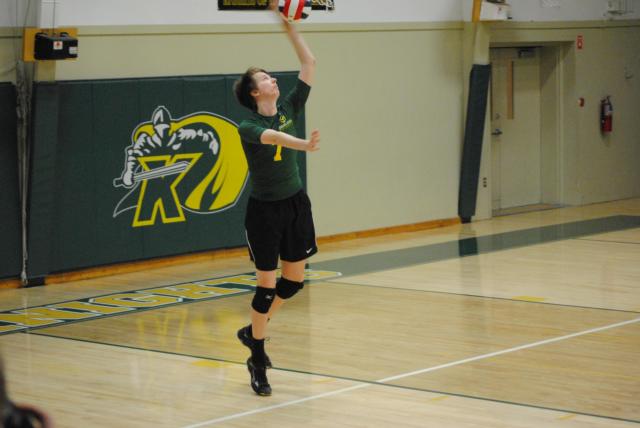 Metro East Lutheran's  AJ Risavy is an all-purpose player at both the net, setting and serving. He is shown against Alton on Tuesday night. (Photo by Brent Feeney)