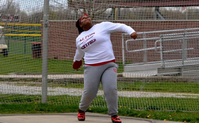 Alton's Alexis James was third in the discus with a toss of 116-9 on Friday at the Lady Maroon Invitational. (Photo by Dan Brannan).