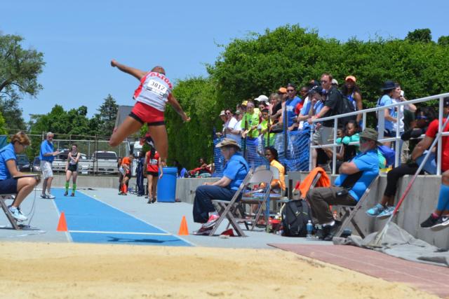 LaJarvia Brown is shown soaring through the air at the Illinois state track and field meet in the spring.