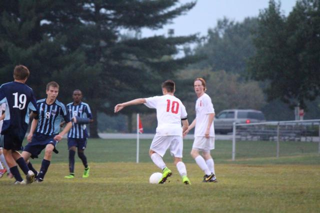 Senior midfielder Nick Hatfield performing his free kick the team earned after a rough trip by the BEHS goalie.