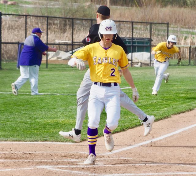 Civic Memorial's Caden Clark (2) touches home plate with Zach Vaughn (24) right behind him on a RBI single by Spencer Powell. 
